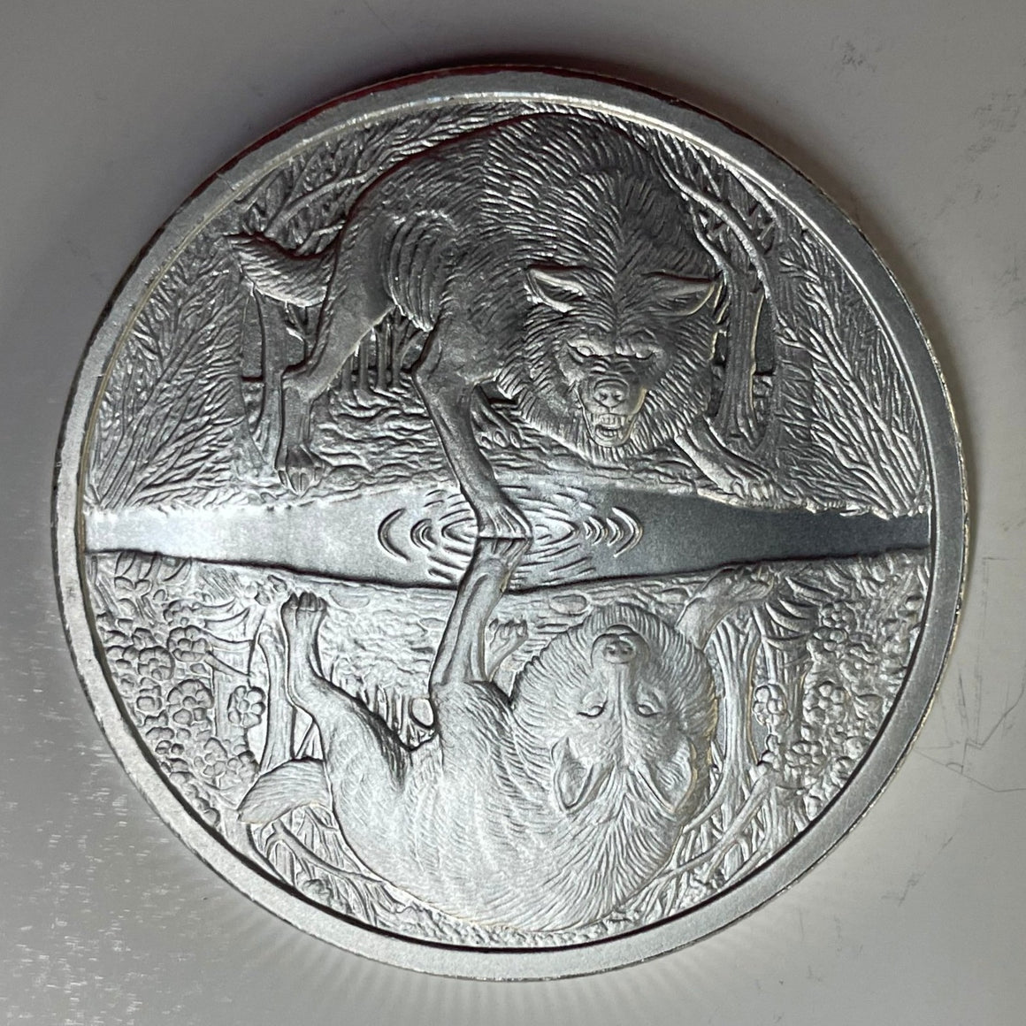 Two Wolves by Pheli Mint., 1oz .999 Fine Silver BU Round